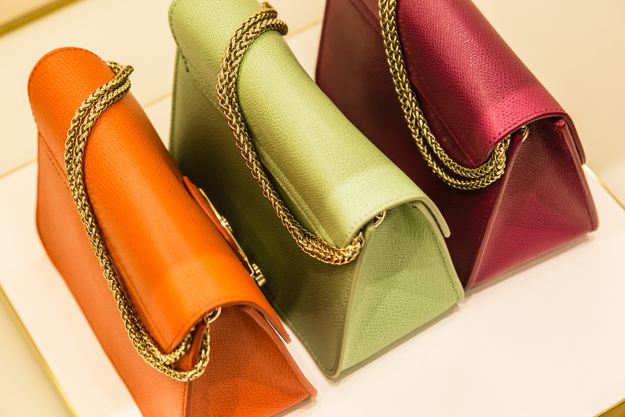 Handbags in different colors on display