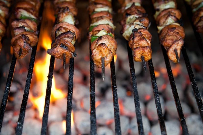 BBQ skewers on a grill, flame, coal