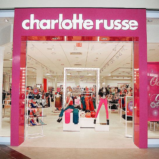Charlotte Russe storefront, mannequins, clothes, and shoes on display