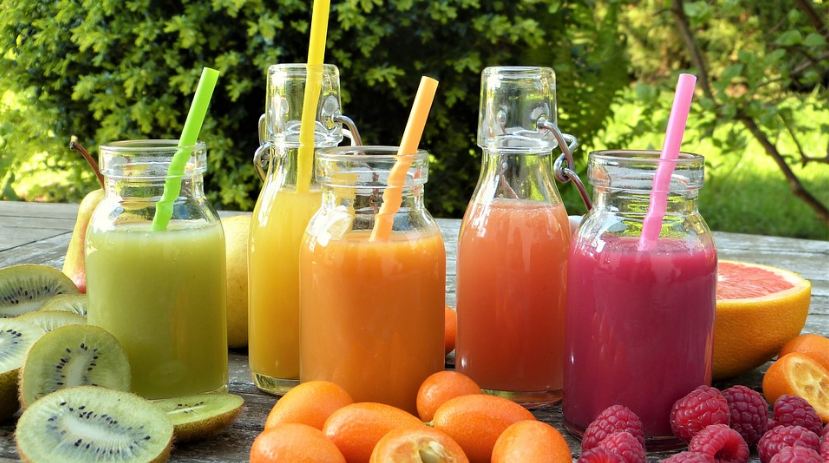 juices, juices in various colors, different kinds of fruits, glasses with straws