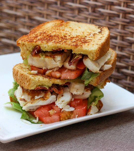 stacked BLT sandwich on a plate
