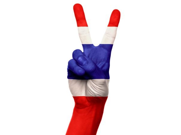 A hand showing the flag of Thailand
