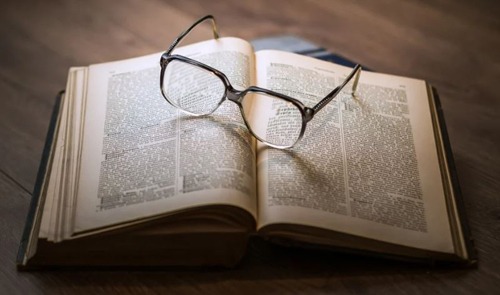 Book and eyeglasses