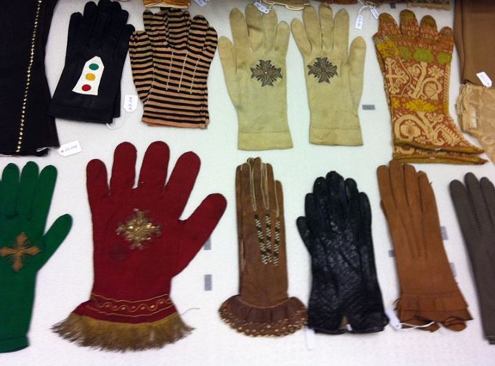 a museum collection of assorted gloves