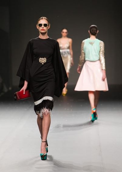 Fashionable women walking on a runway