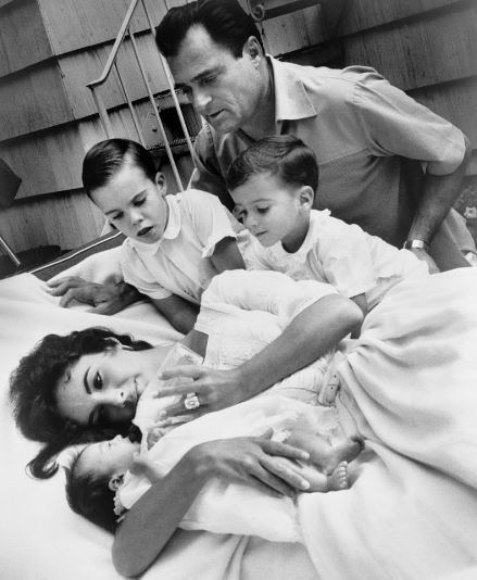 Taylor with her third husband Mike Todd and her three children in 1957