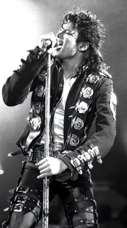 a black and white photo of Michael Jackson performing in June 1988