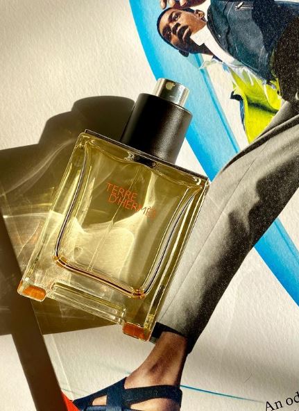 a bottle of Hermes Terre D’ Parfum on top of a magazine