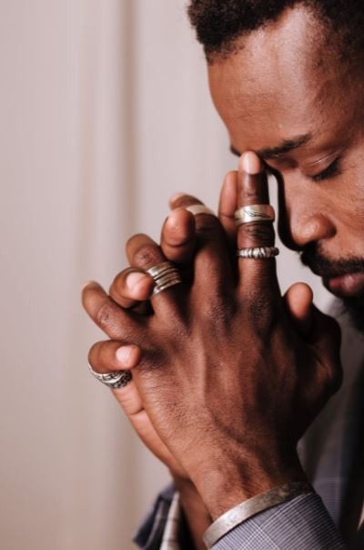 a man in deep thoughts wearing rings