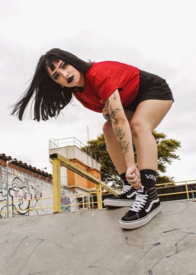woman in a skate park wearing the Vans Sk8-Hi