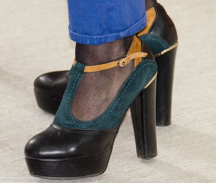 the feet of a woman wearing platform shoes