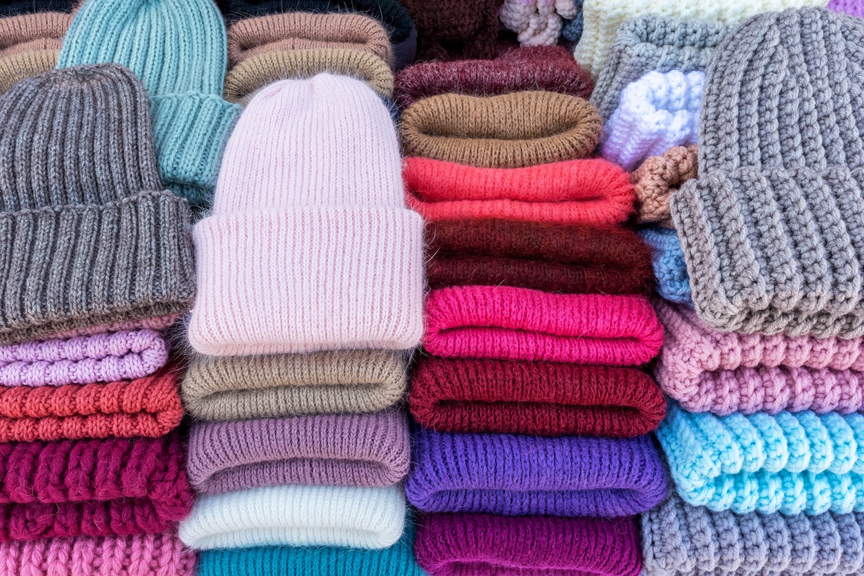 handmade knitted wool hats are sold at the street market