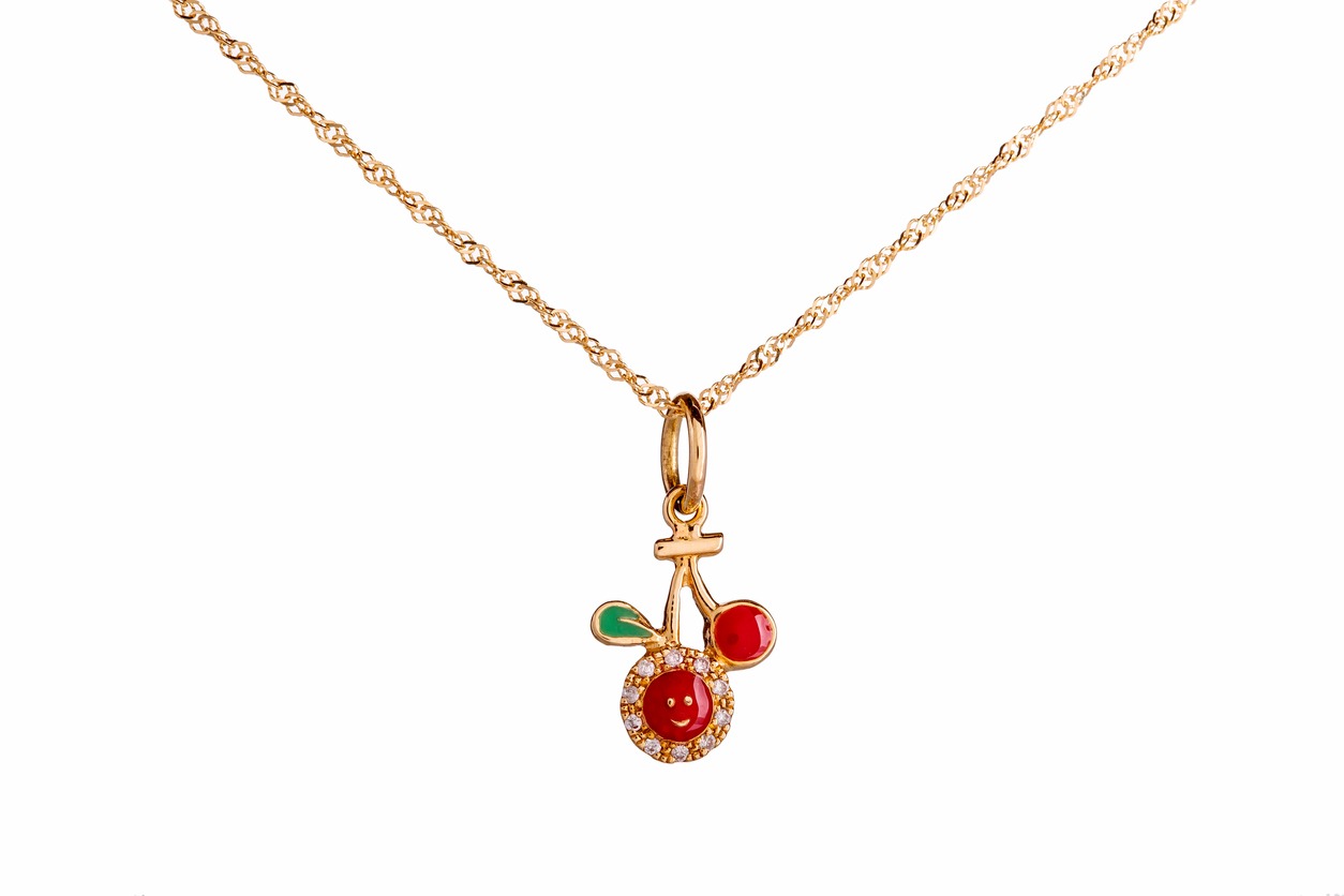 Beautiful Cute Baby & Kids Necklace Jewelry with the red cherry pendant in yellow gold and diamond, ideal birthday baby gift isolated on white background