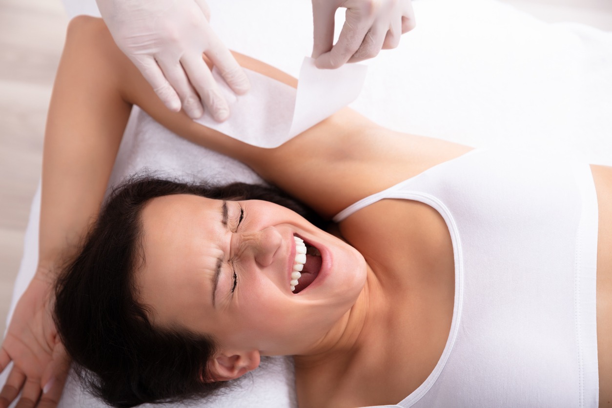 Woman Going Through Armpit Hair Removal Procedure