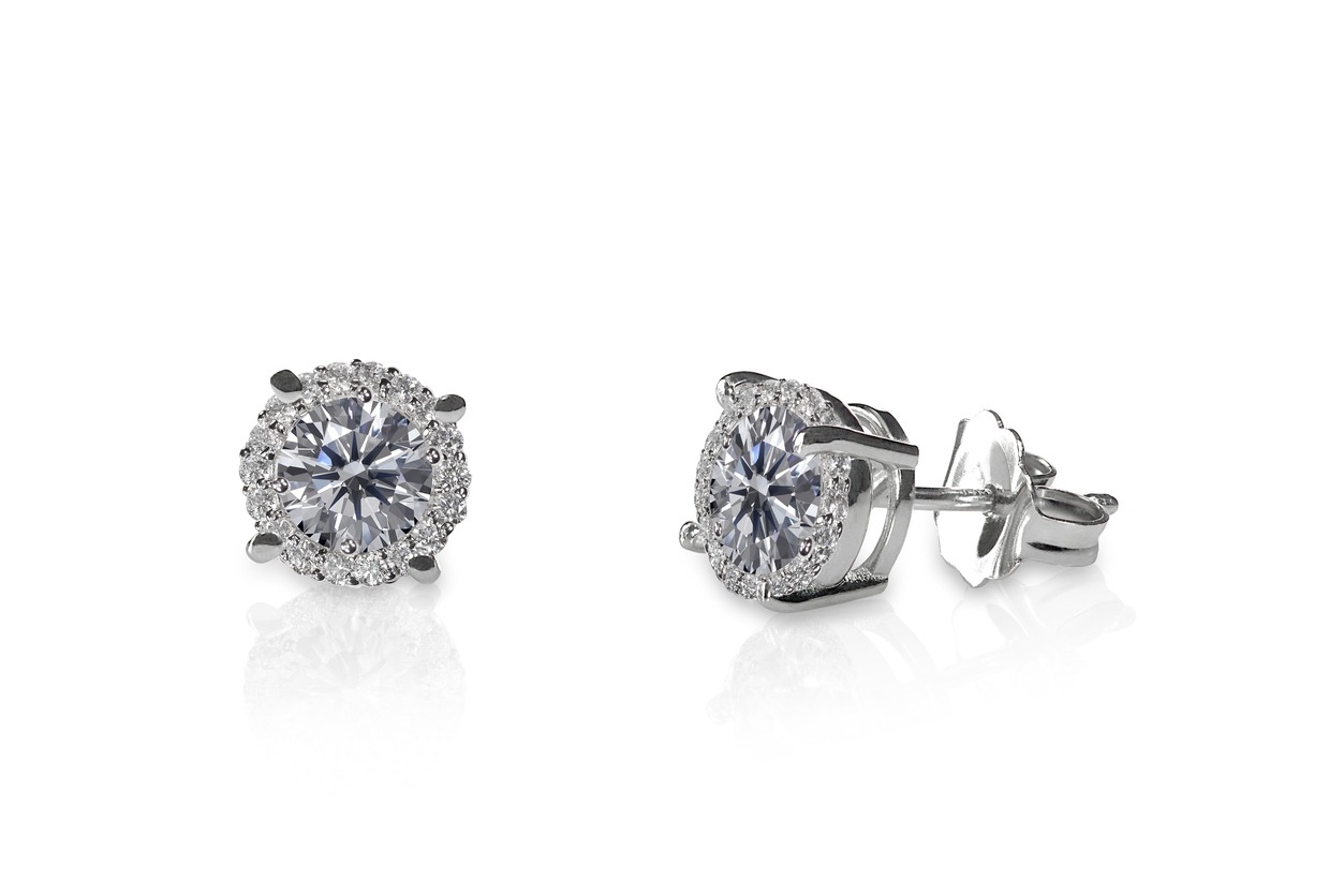 Beautiful Diamond stud earrings isolated on white with a reflection
