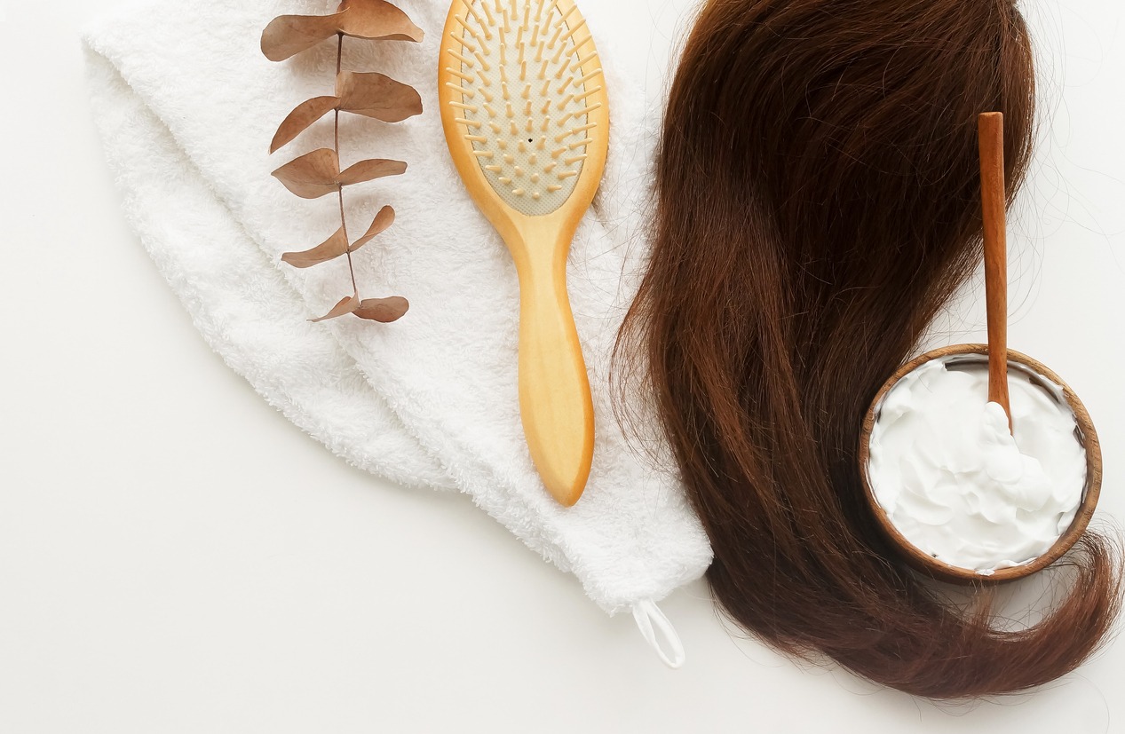 hair mask and bamboo comb on white background top view, flat lay. copy space. Self care, hair treatment  concept