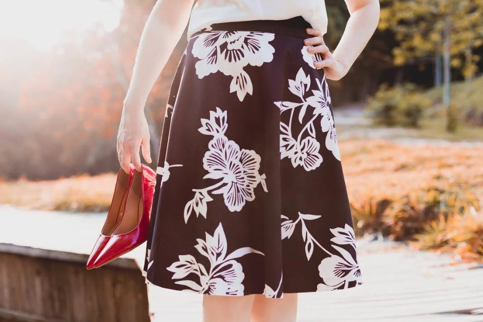 woman wearing a printed A-line skirt