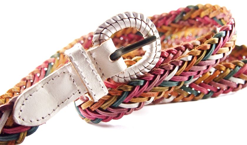 A pink tone woven belt with white buckle