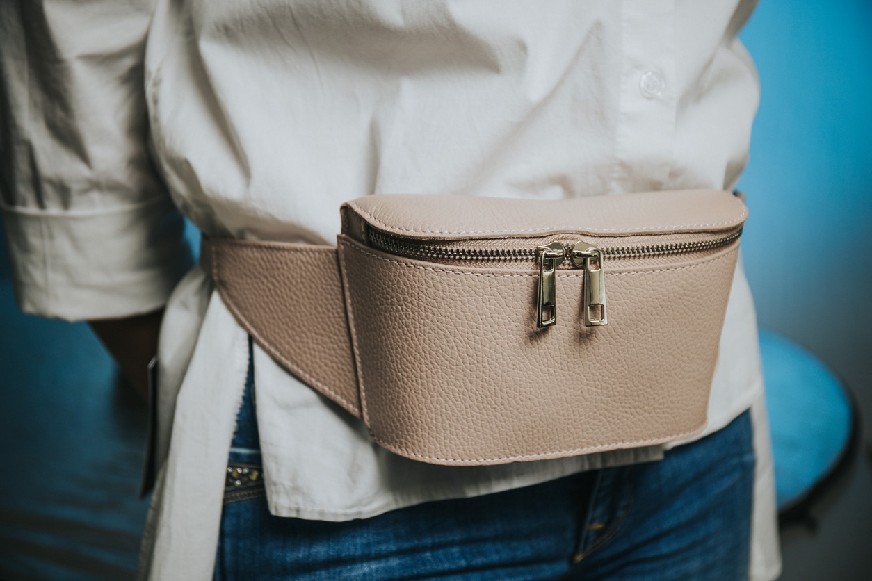 A woman wearing a fashionable belt bag
