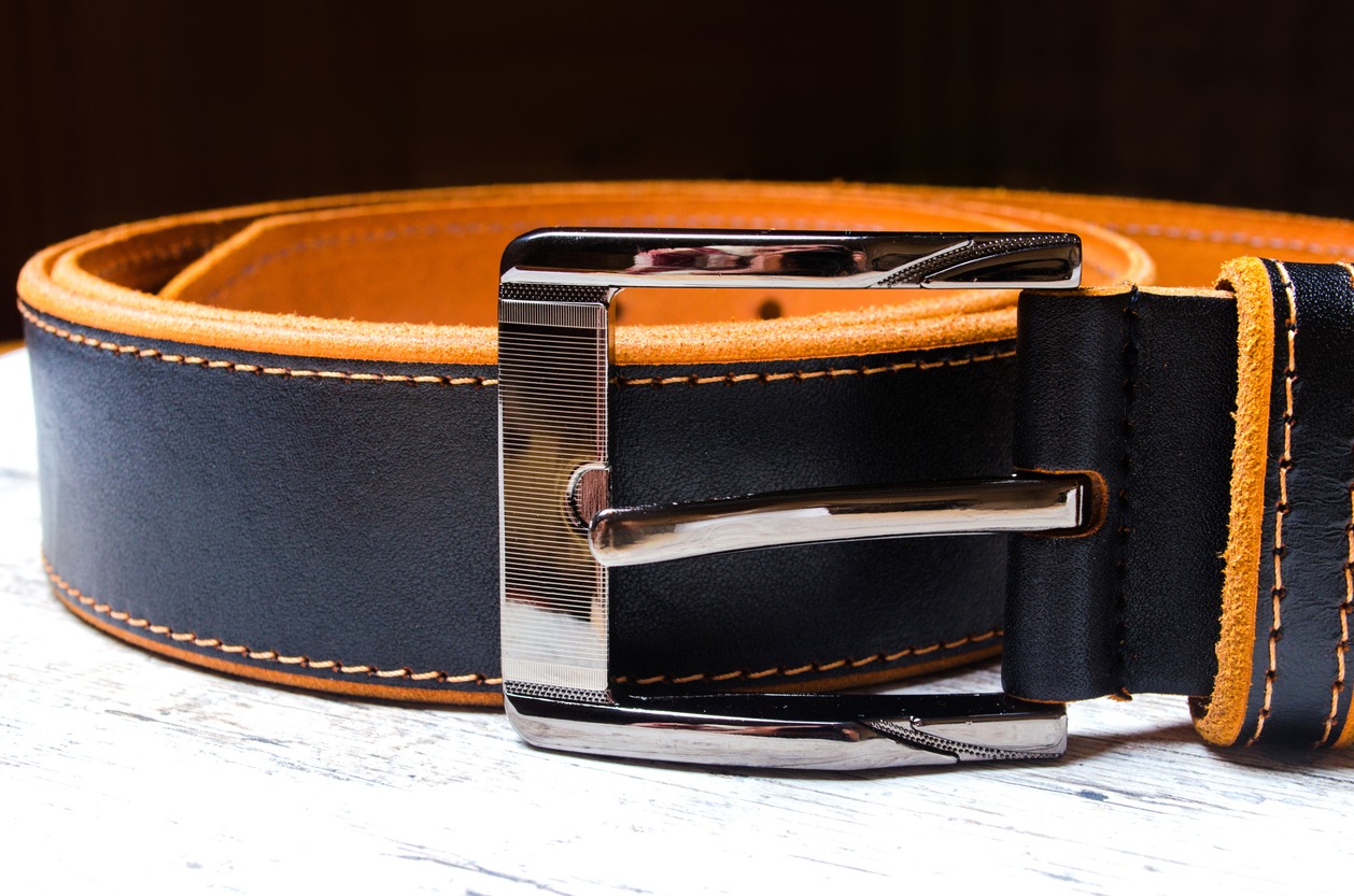 Black leather men's belt with silver buckle