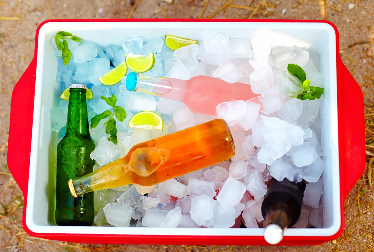 Cooled drinks of many colors in an ice box.