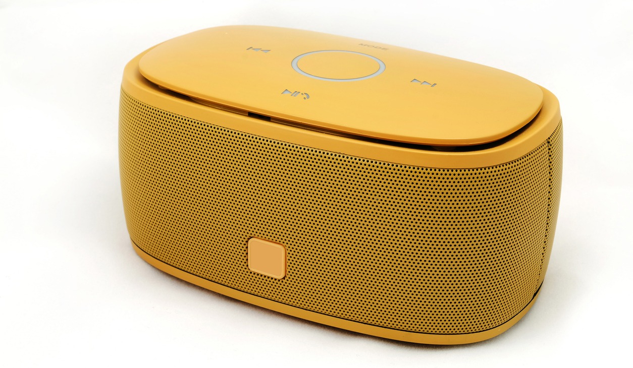 Portable speaker in yellow against a white background.