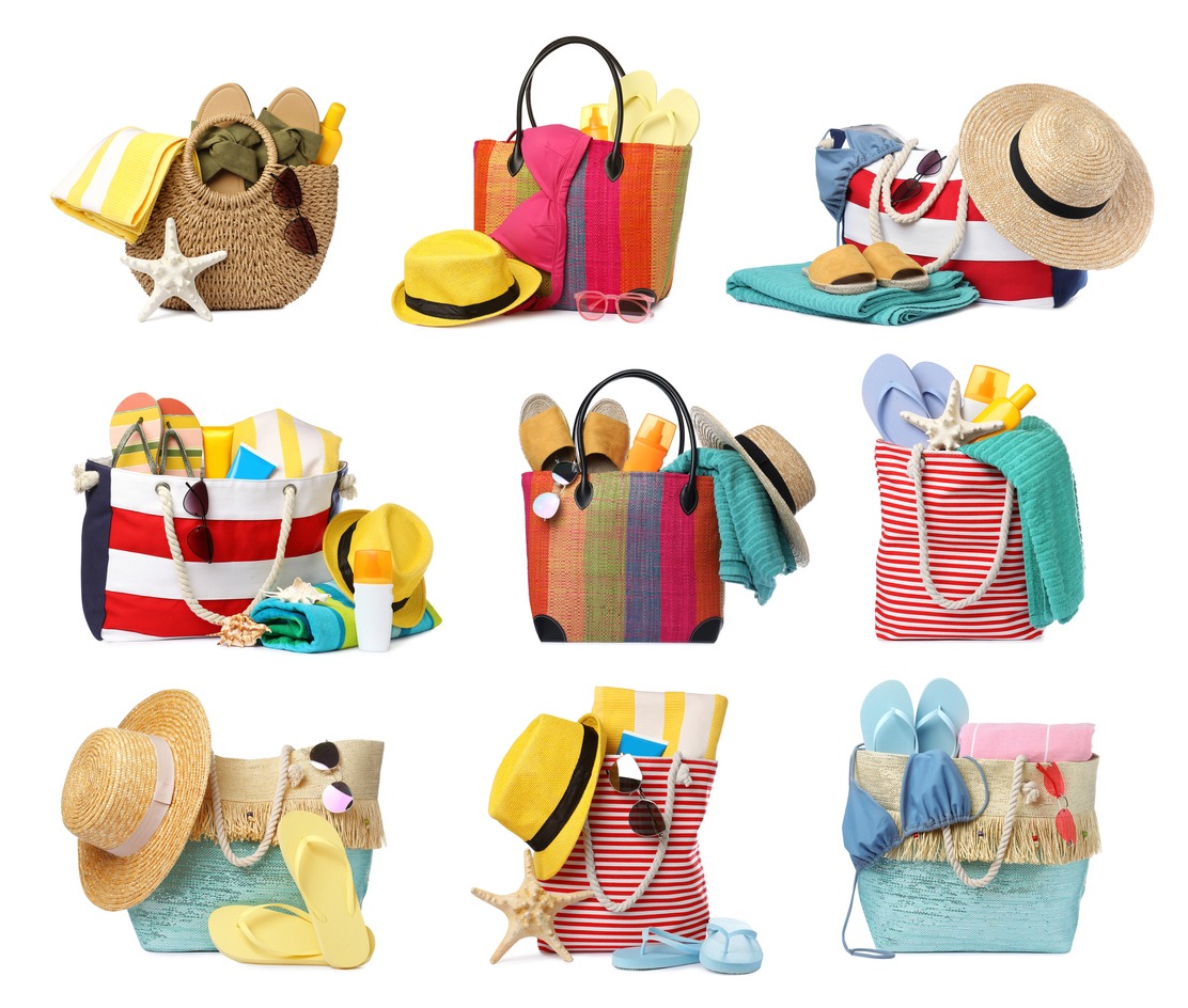 Set of various fashionable bags and beach accessories on a white background.