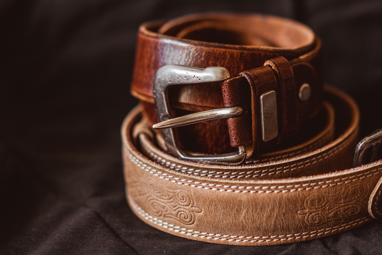 Two brown leather belts.