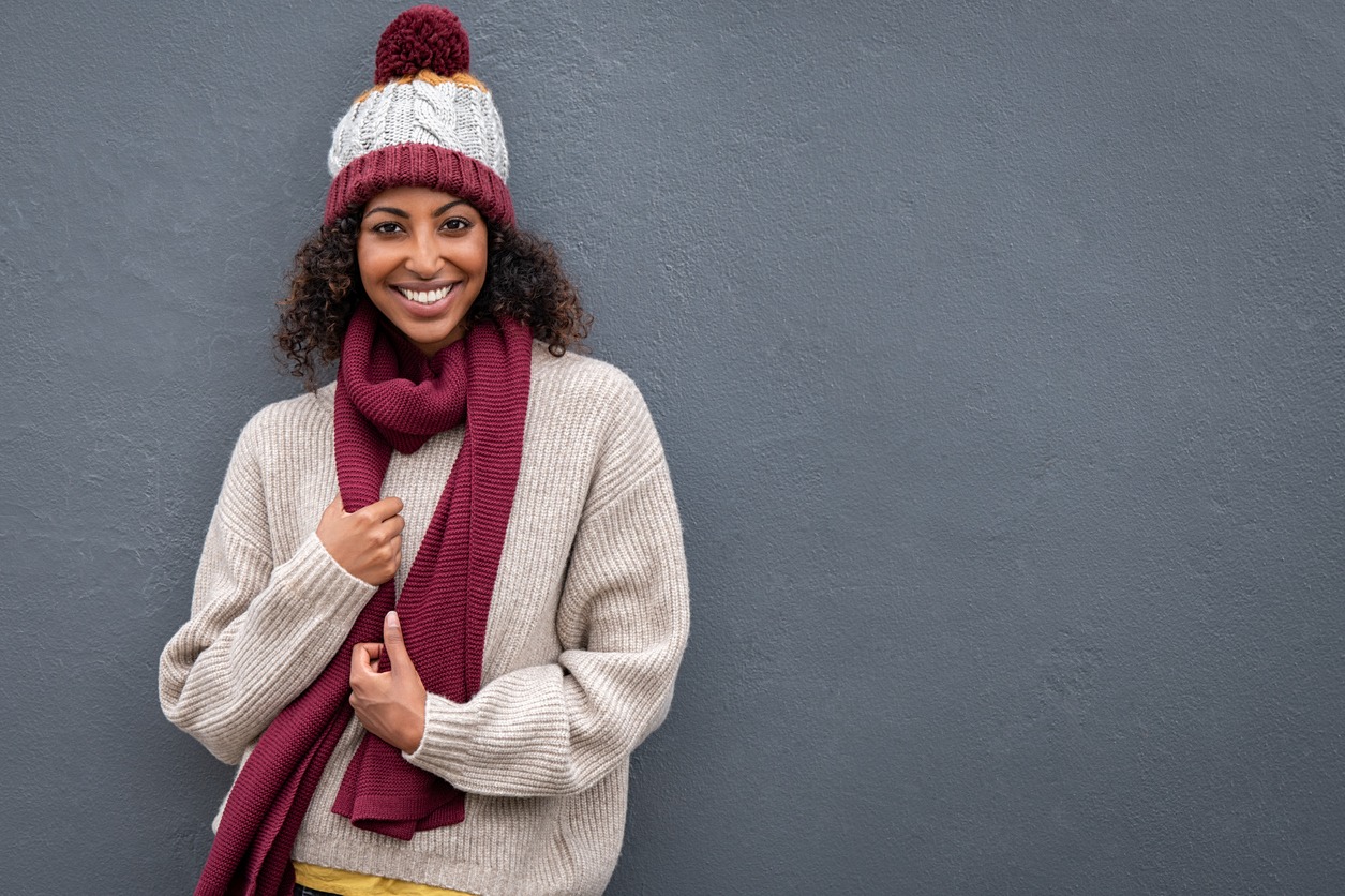 Happy black woman wearing warm clothes