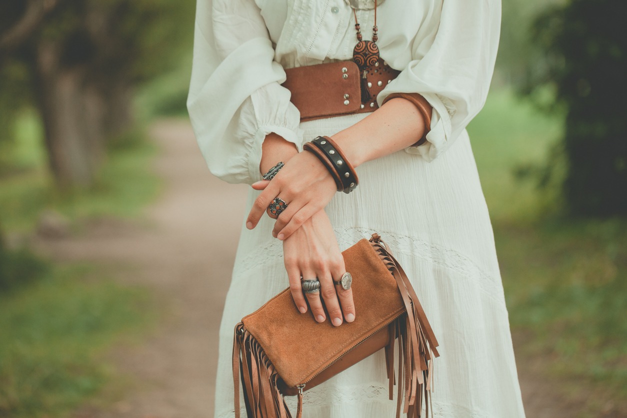 Brown handbag in the hands of a woman