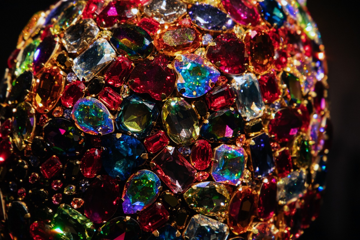 Christmas decoration made of shiny colorful bijouterie crystals, close up photo with selective soft focus