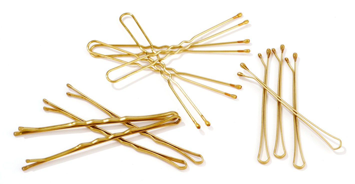 golden hairpins isolated on white