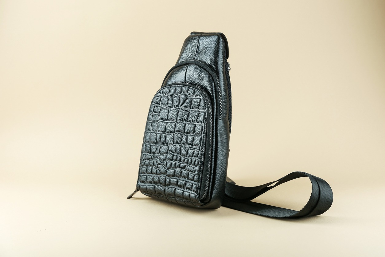 an upright black sling backpack