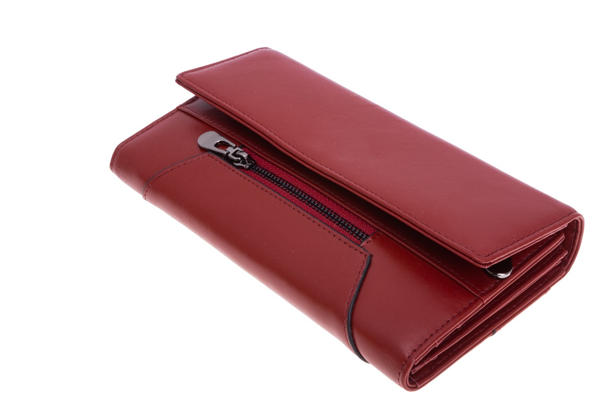 Female red wallet against a white background