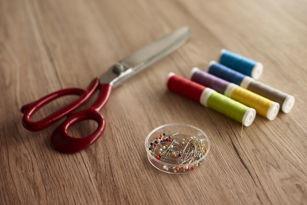 Items for sewing that are colorfully displayed on a table