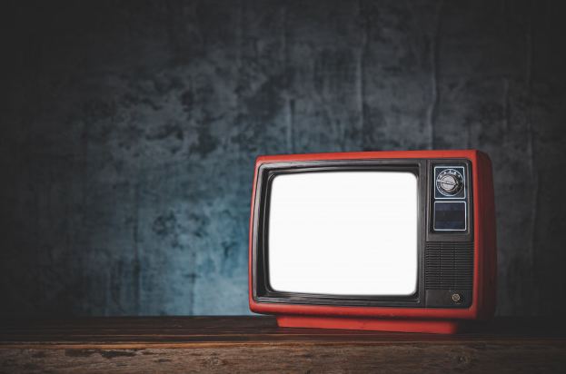 Picture-of-a-red-old-retro-styled-TV-with-a-dark-background