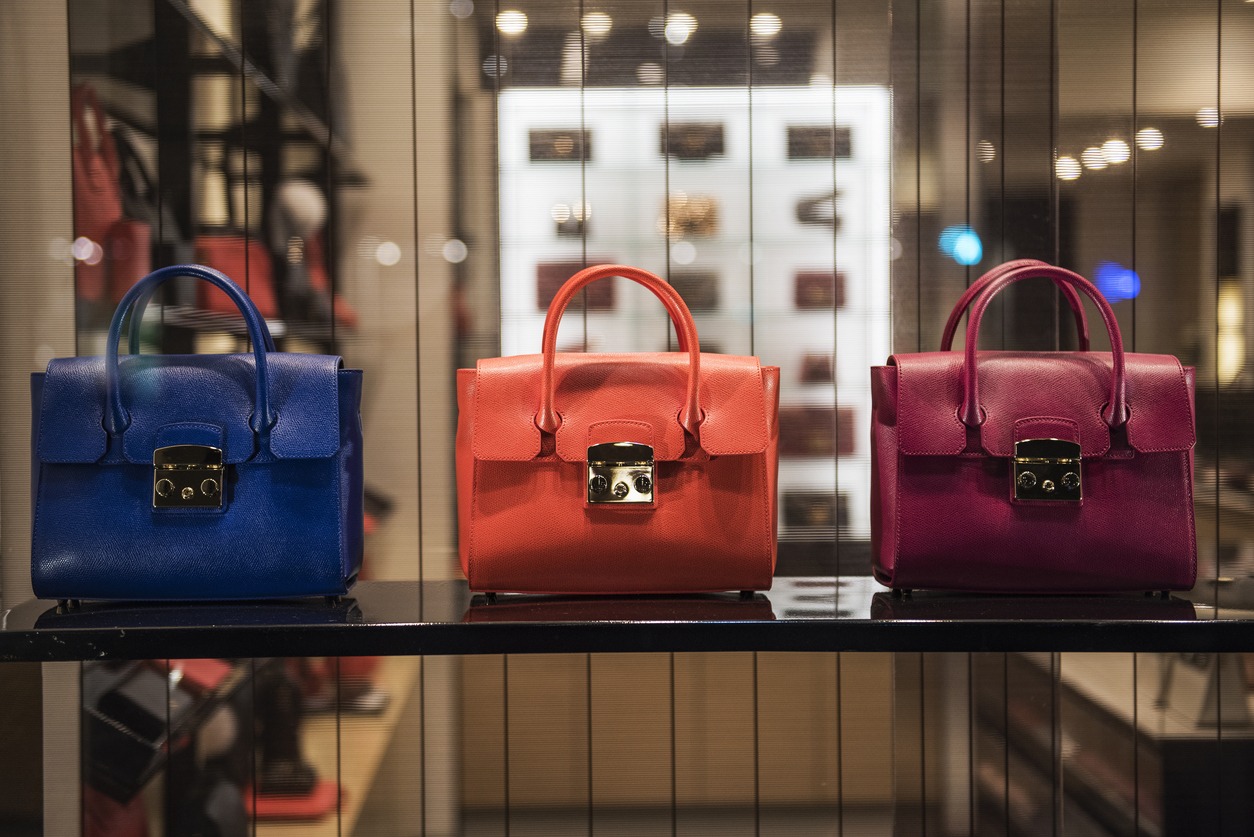 Three luxury handbags of the same design but different colors