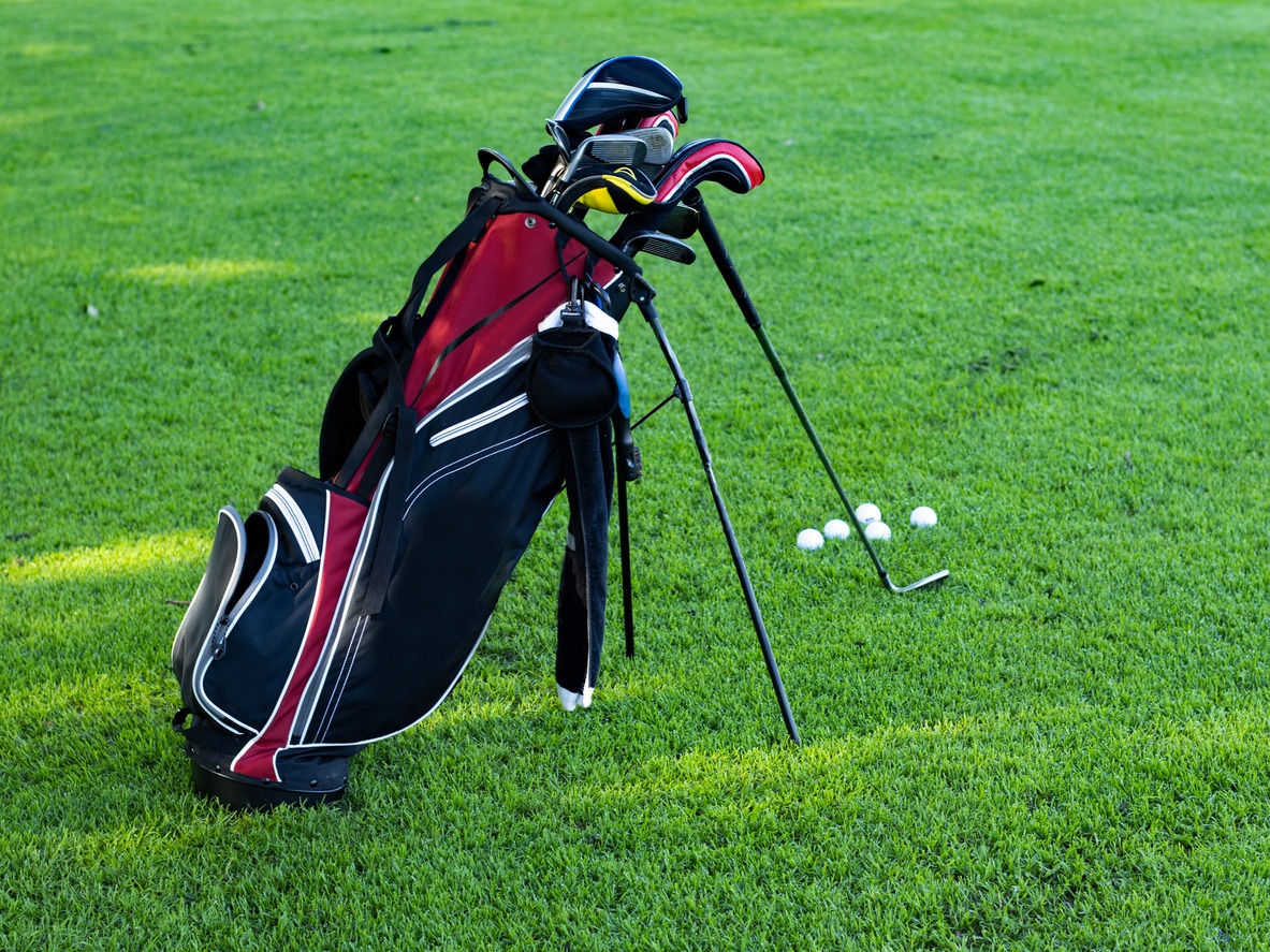 a red and black golf stand bag