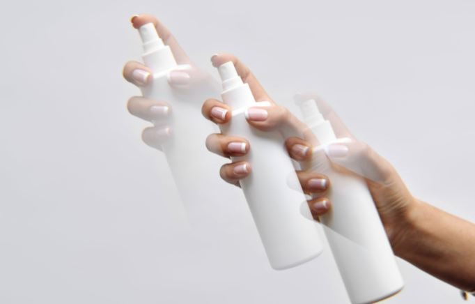 person-holding-white-plastic-tube