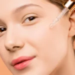 picture of a woman applying serum on her face