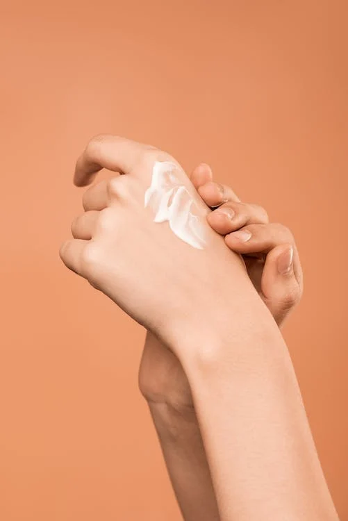 picture of person applying hand cream