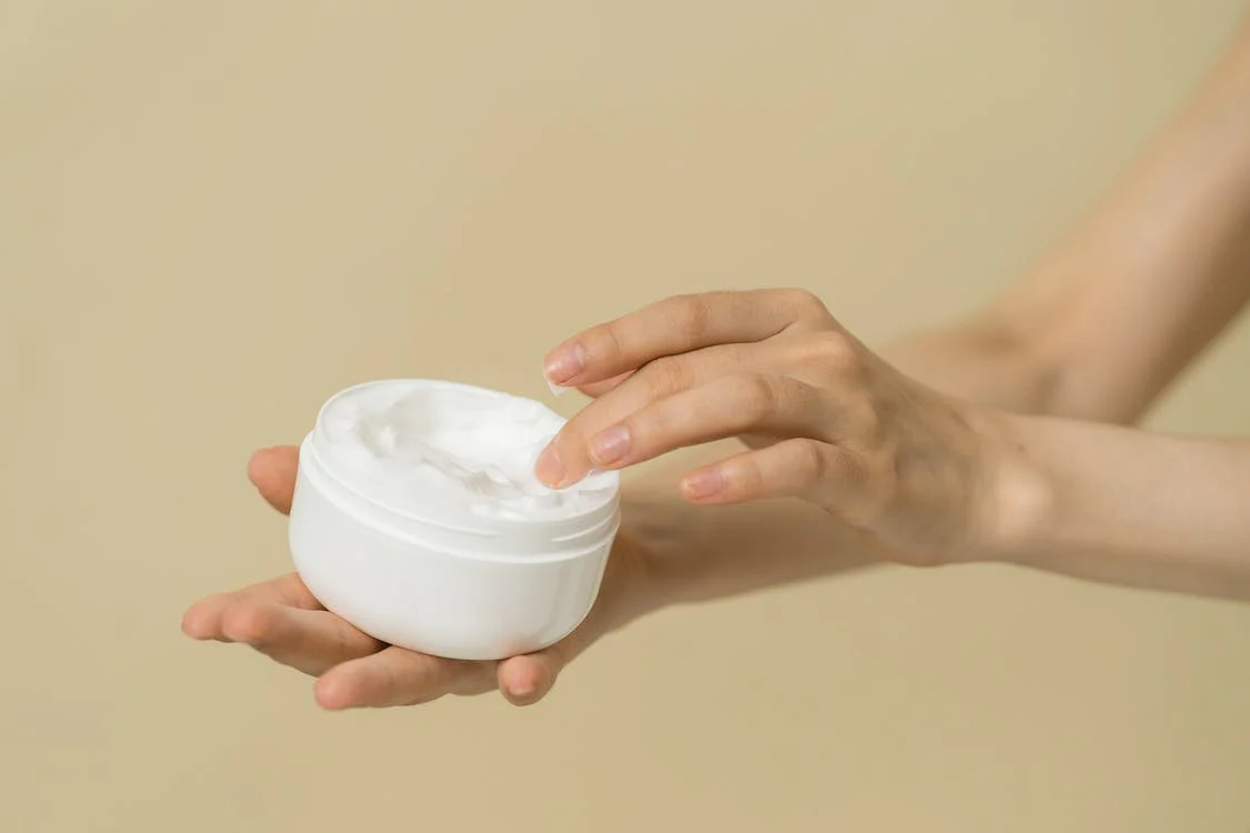 picture of person holding a cream