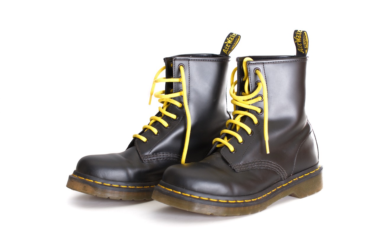 Classic black doc martens lace up boots with yellow laces