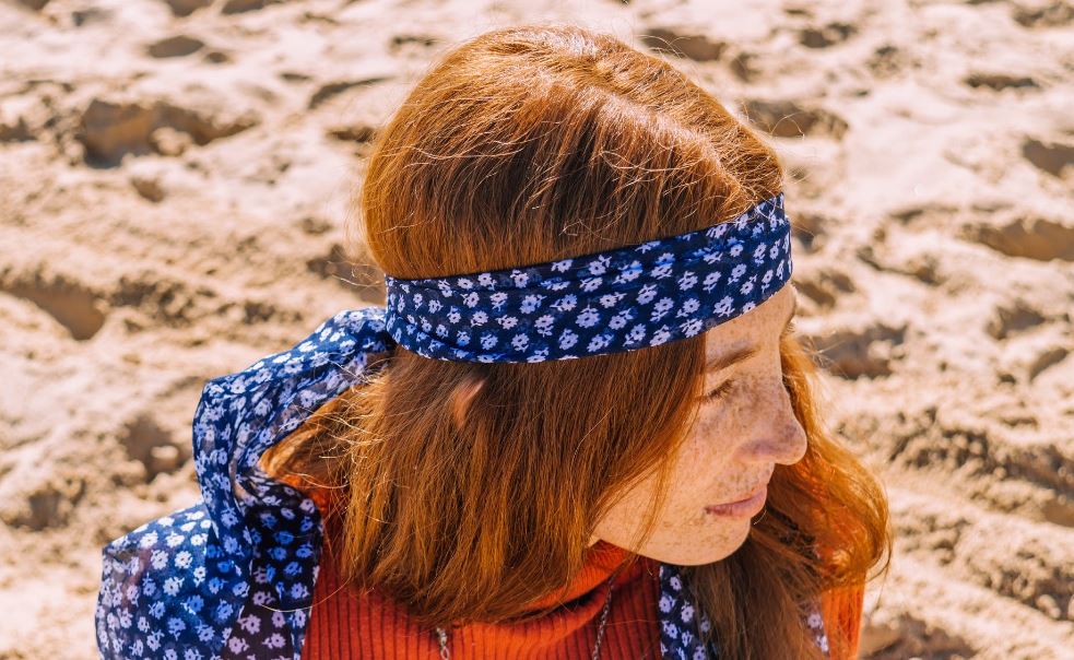 a-woman-at-the-beach-wearing-a-headscarf