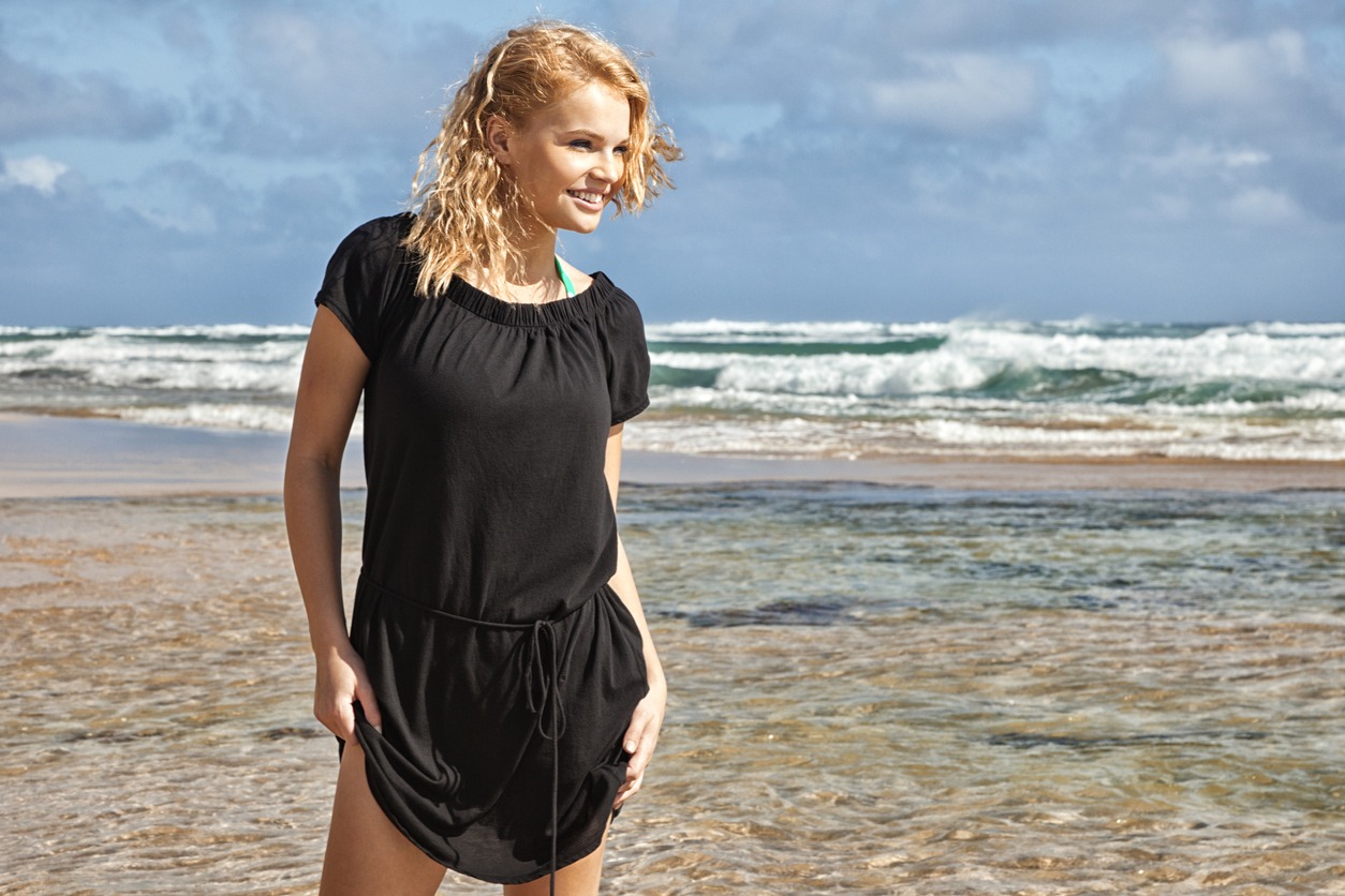 Attractive Young Blonde Woman in Black Beach Cover-up